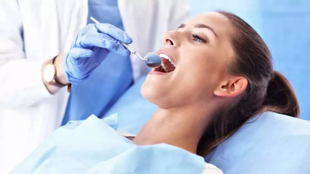Woman Getting Her Teeth Checked By The Dentist